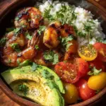 Delicious grilled shrimp served in a vibrant bowl with fresh vegetables.